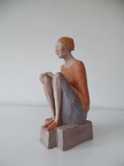 Figura seduta